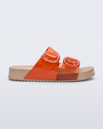 Side view of a orange Cozy slide with beige sole