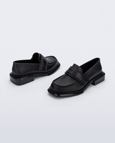 Back and angled view of a pair of black Spencer loafers