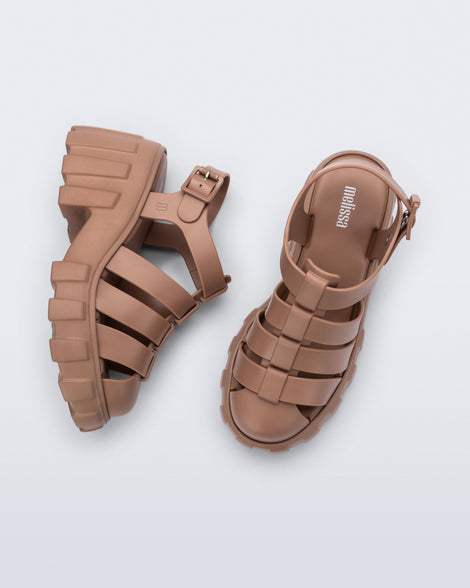 Side and top view of a pair of brown Megan platform sandals