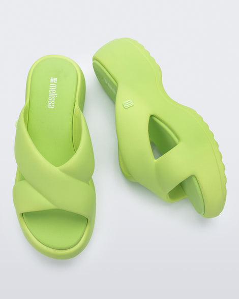 Side and top view of a pair of green Free Rise platform slide
