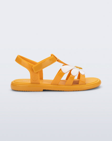 Side view of an orange Hip Bloom kids sandal