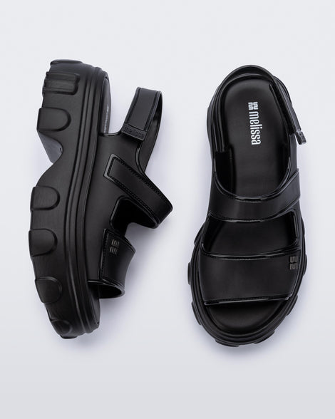 Top and side view of a pair of black Ella Move platform sandals.