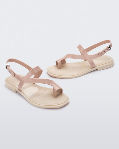 Angled view of pair of pink Cassie sandals.