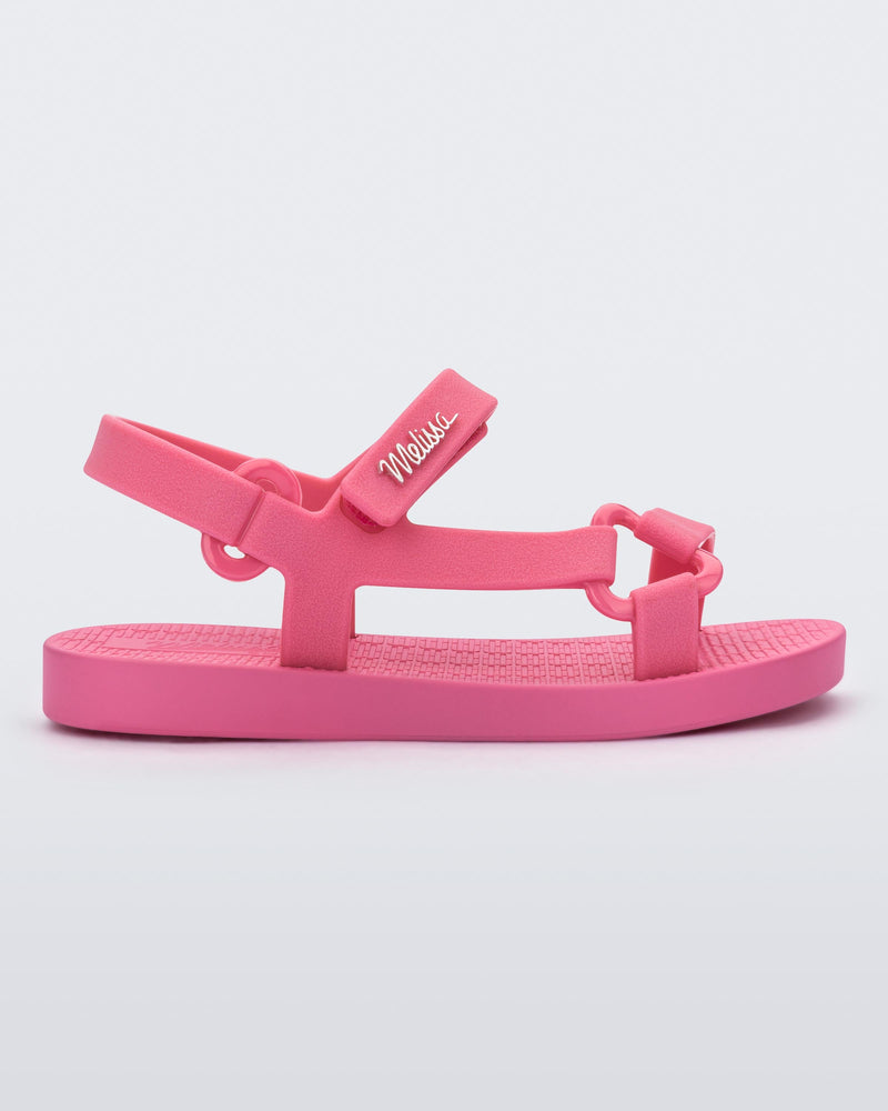 Side view of a pink Sun Downtown baby sandal