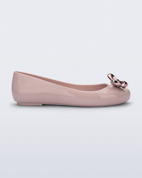 Side view of a pink Sweet Love Glam ballerina flat with pink chrome bow