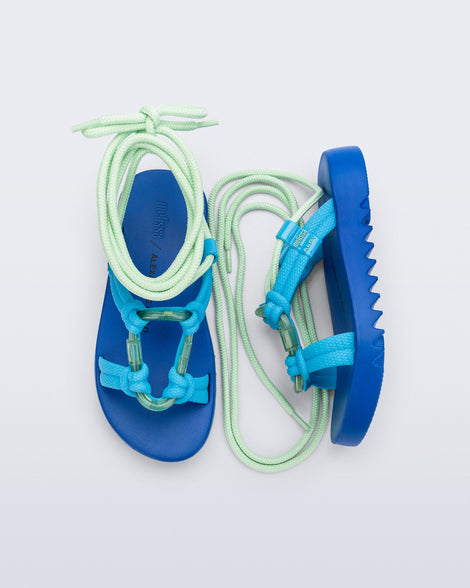 Side and top view of a pair of blue sole, blue upper, and green ankle strap Kirk + Alexandre Pavao sandals