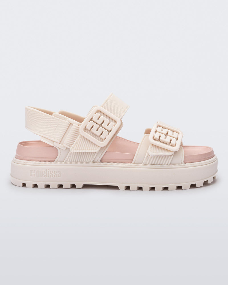 Side view of a pink Towny sandal with straps
