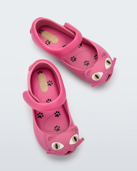 top view of a pair of pink baby Possession Cat flats