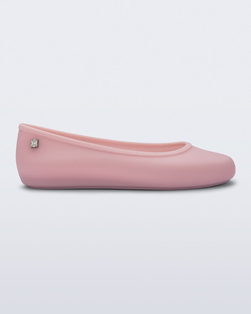 Side view of a pink Soft Ballerina Essential Flat