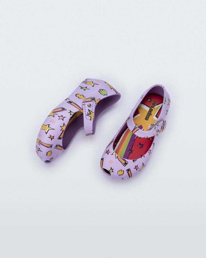 Top and side view of a pair of lilac Ultragirl Colors baby flats with shooting stars
