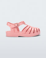 Side view of a light pink baby Possession sandal