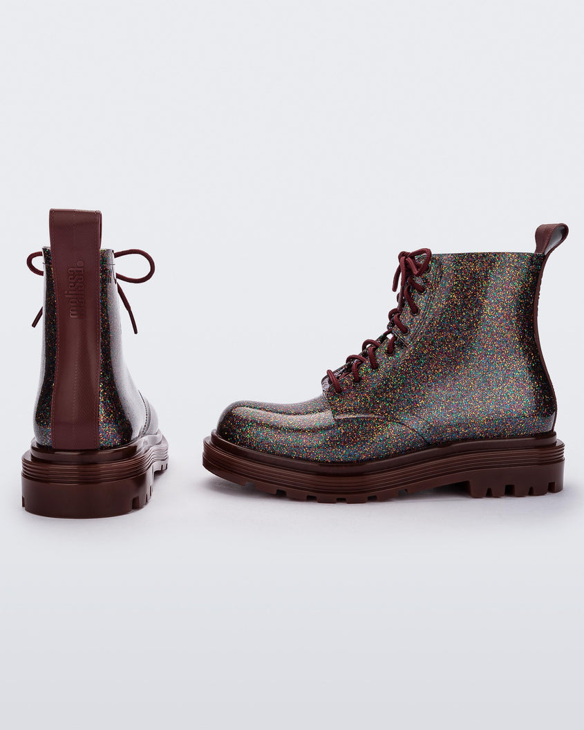 Side and back view of a pair of black/multicolor glitter Melissa Coturno boots.