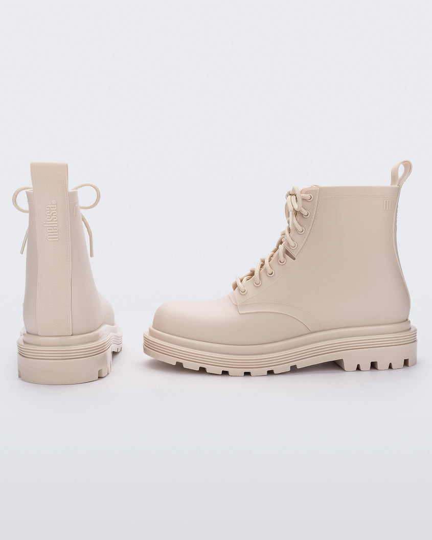 Side and back view of a pair of a beige Melissa Coturno boots.