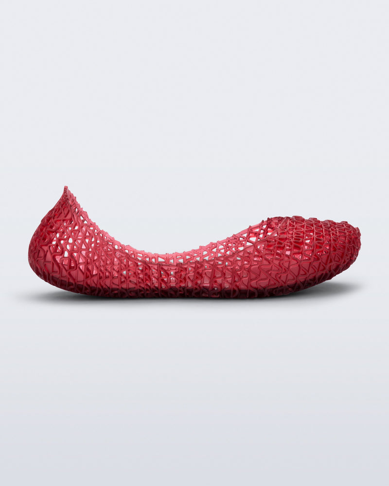 Side view of a red Campana kids ballerina flat