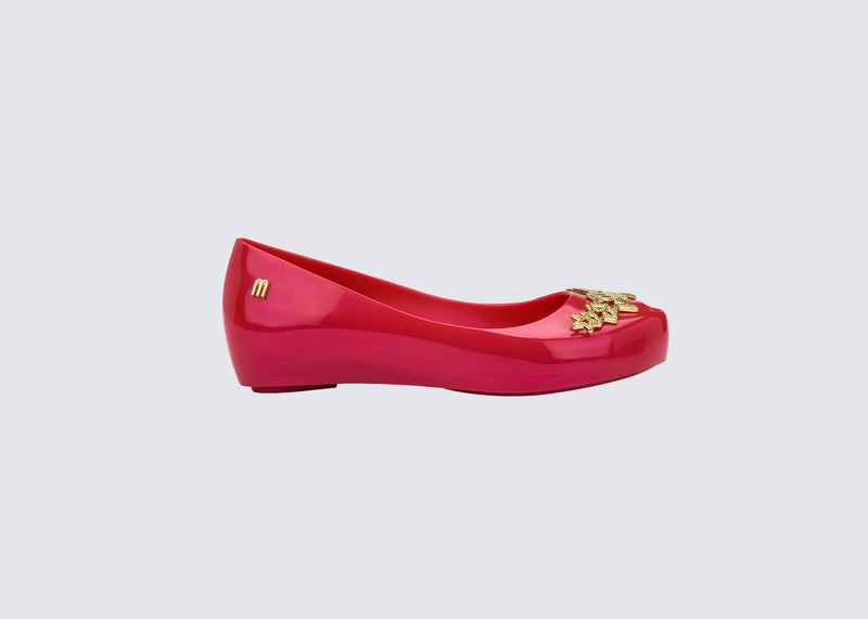 Side view of a red Ultragirl Stars kids ballerina flat with stars on the upper