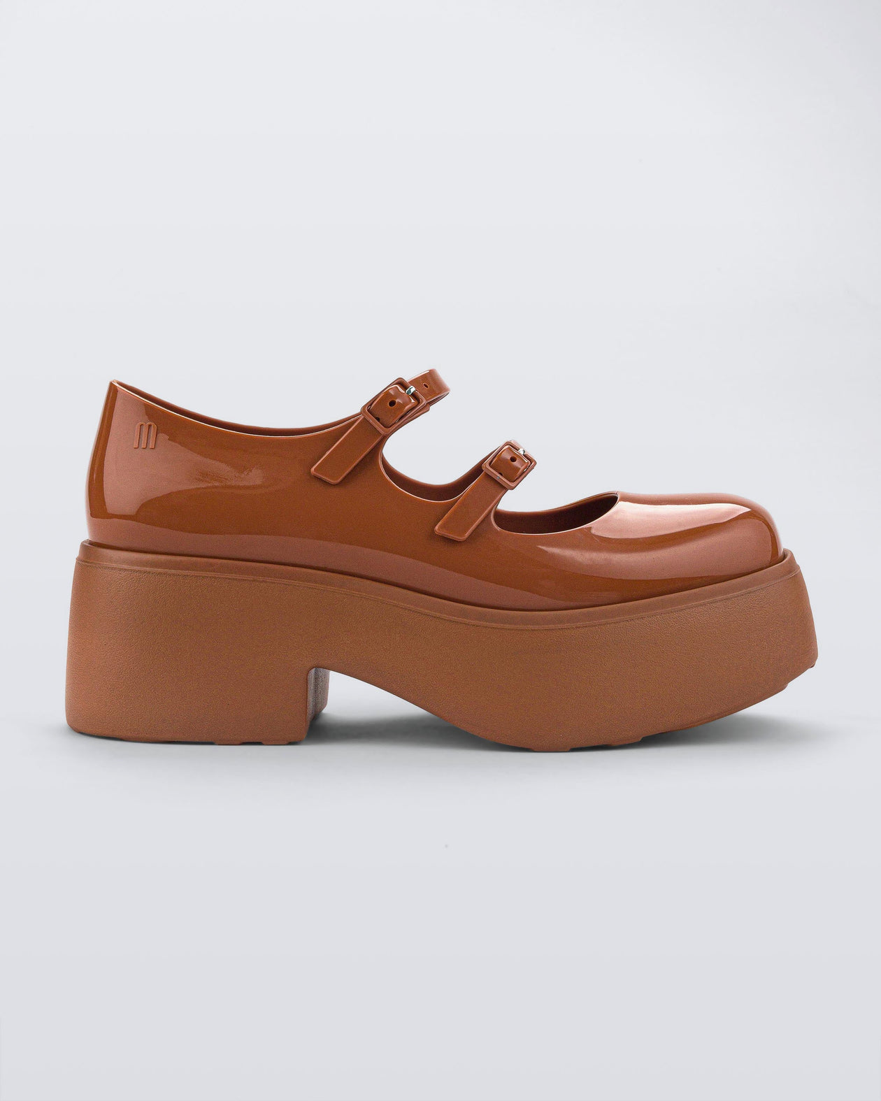 Side view of a brown Melissa Farah Platform.