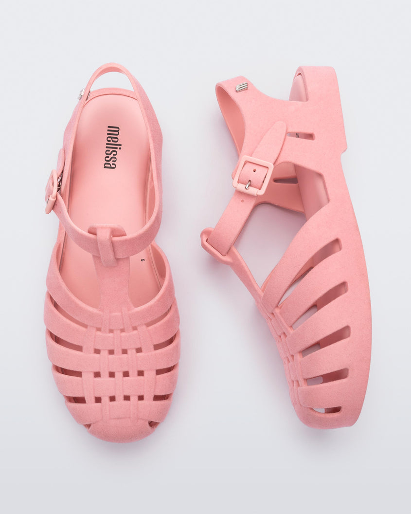 Top and side view of a pair pink flocked Melissa Possession Velvet sandals.