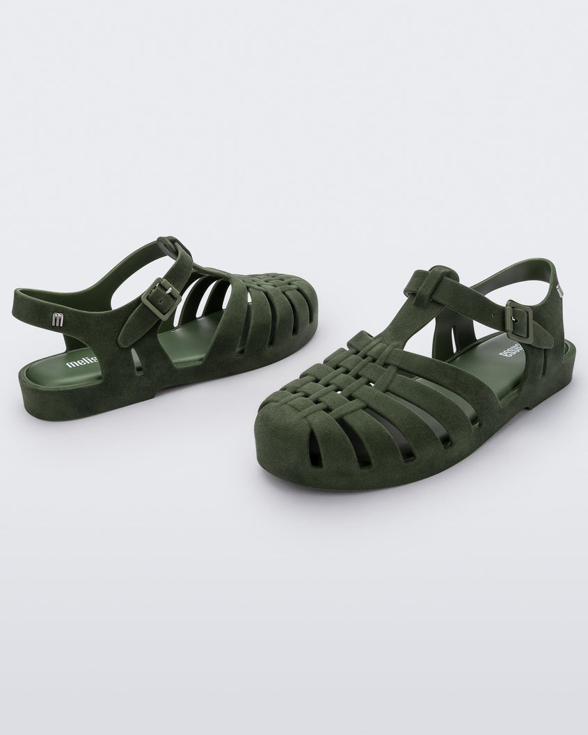Angled view of a pair green flocked Melissa Possession Velvet sandals.