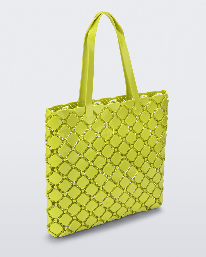 Angled view of a yellow Melissa Mogu + Hikaru Matsumura bag