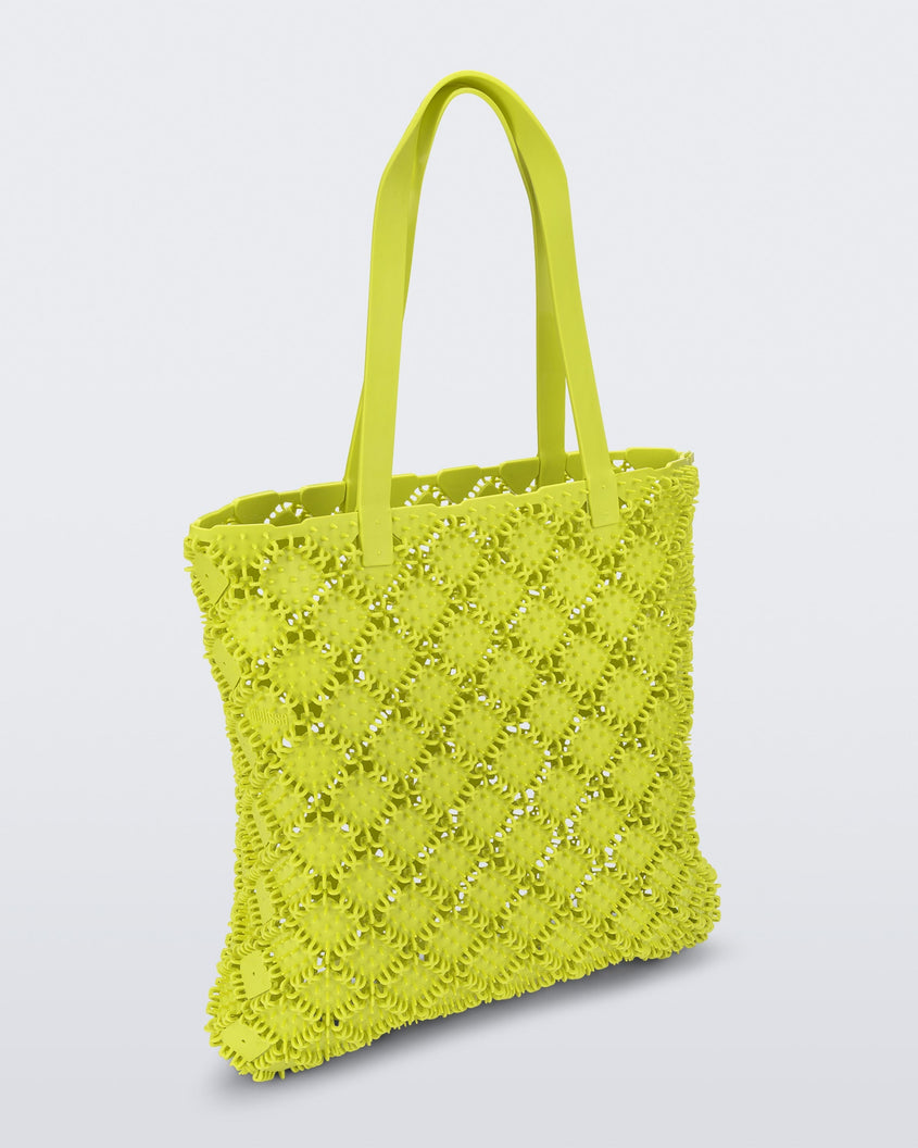 Back view of a yellow Melissa Mogu + Hikaru Matsumura bag