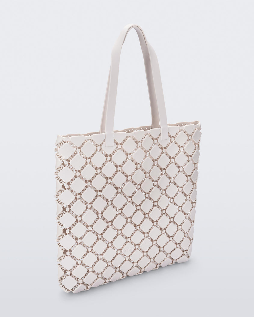 Angled view of a white Melissa Mogu + Hikaru Matsumura bag