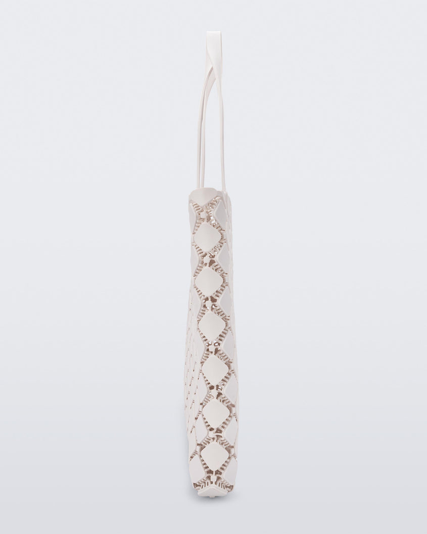 Side view of a white Melissa Mogu + Hikaru Matsumura bag