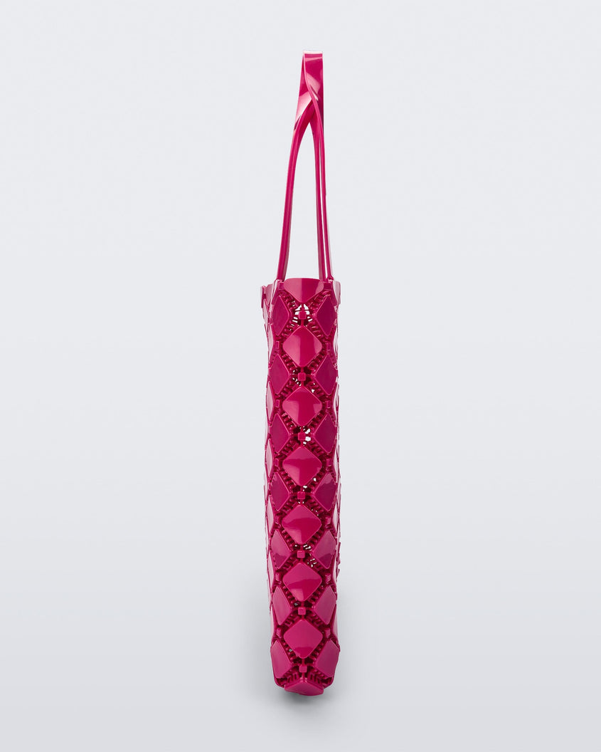 Side view of a pink Melissa Mogu + Hikaru Matsumura bag