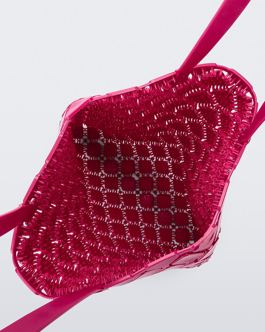 Top view of a pink Melissa Mogu + Hikaru Matsumura bag