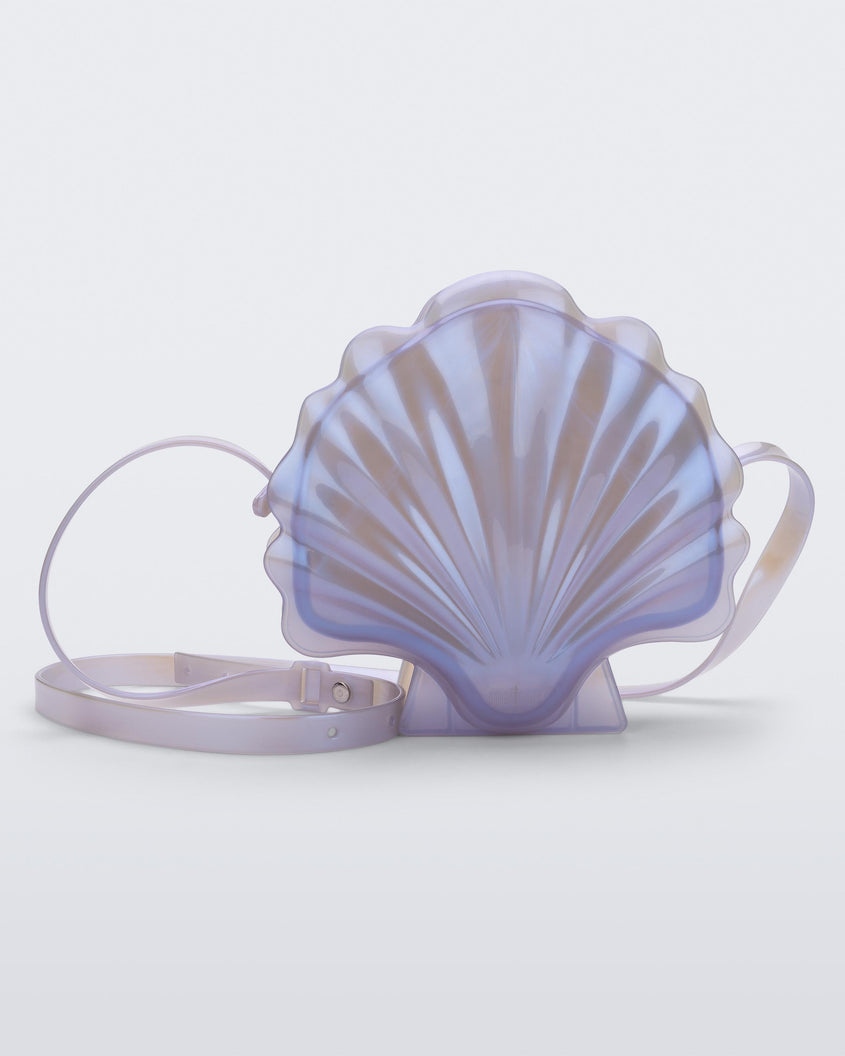 Front view of a pearly blue Melissa Shell + Disney Little Mermaid bag with strap.
