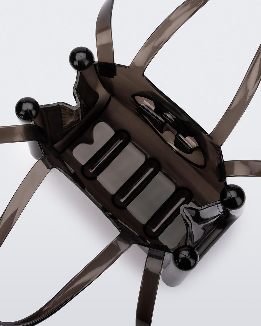 Top view of a black small Melissa Jelly Shopper bag + Telfar bag with a handle and straps.