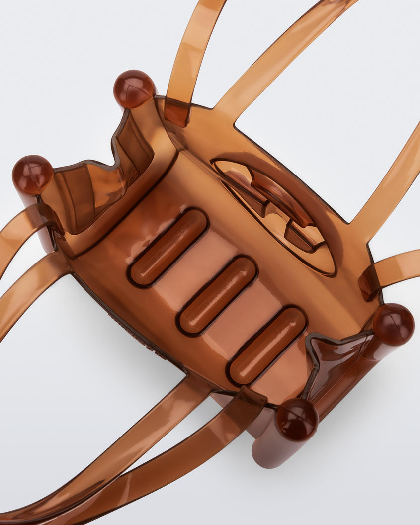 Top view of a brown small Melissa Jelly Shopper bag + Telfar bag with a handle and straps.