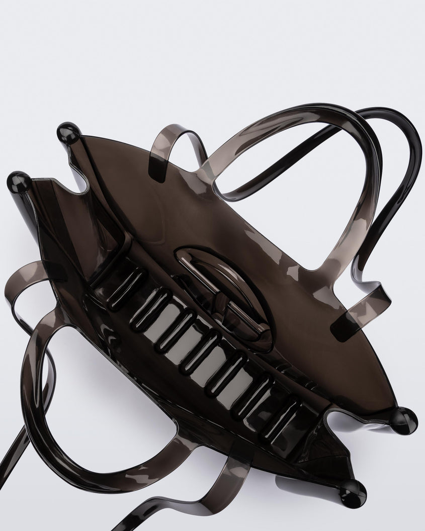 Top view of a black large Melissa Jelly Shopper bag + Telfar bag with a handle and straps.
