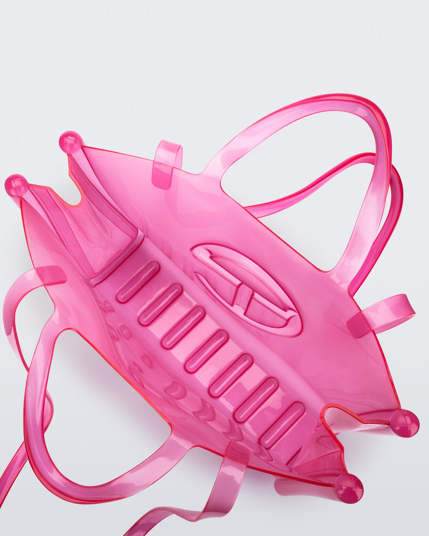 Top view of a pink large Melissa Jelly Shopper bag + Telfar bag with a handle and straps.