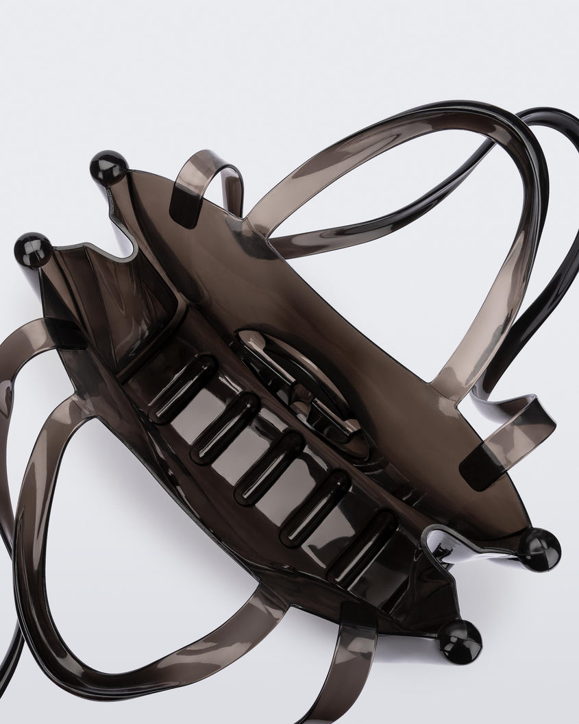 Top view of a black medium Melissa Jelly Shopper bag + Telfar bag with a handle and straps.