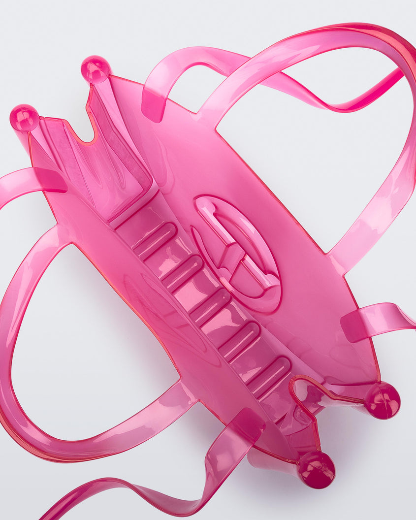 Top view of a pink medium Melissa Jelly Shopper bag + Telfar bag with a handle and straps.