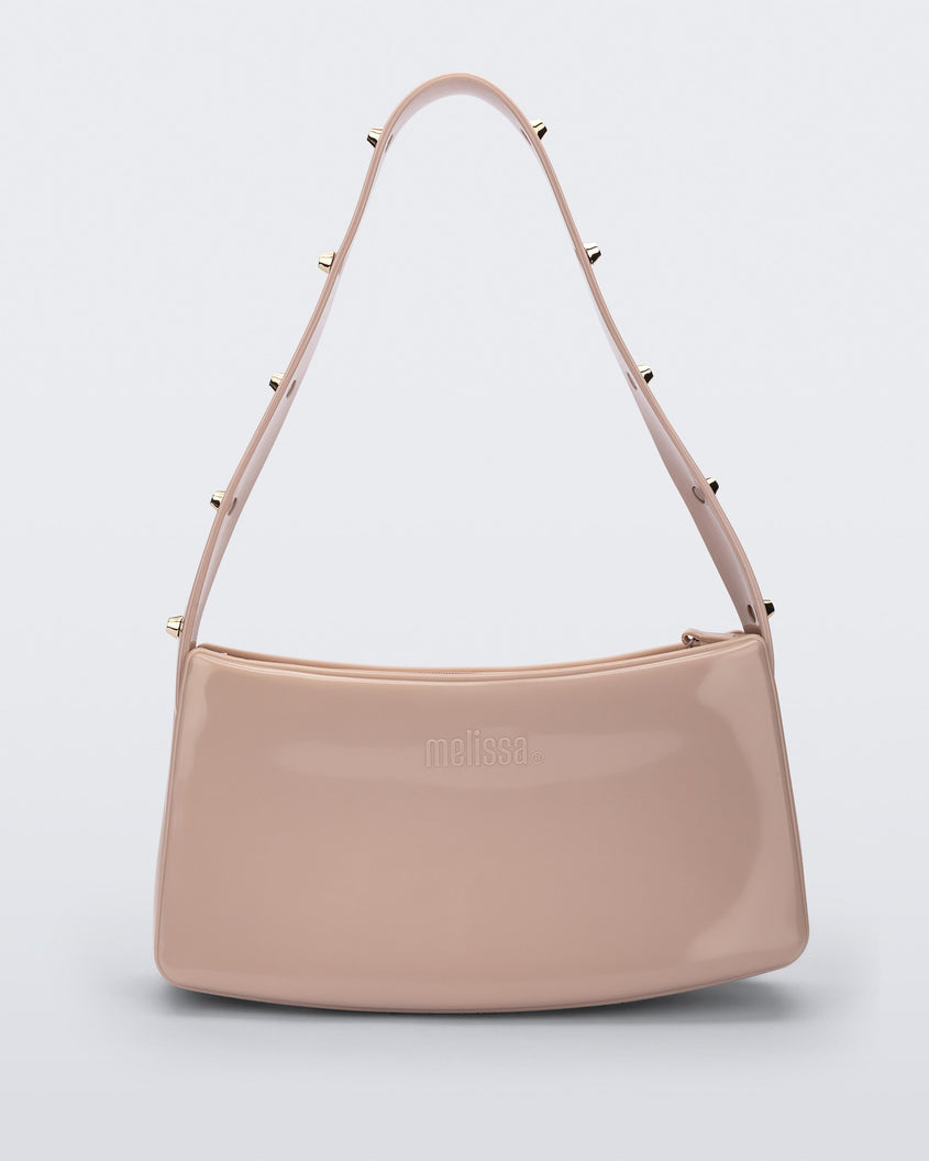 Front view of the pink Melissa Baguete Studs bag with a short studded strap.