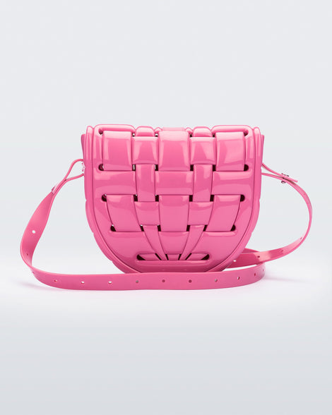 Back view of a pink Possession Bag with strap.