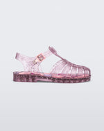 Side view of a clear pink Possession kids sandal with star glitter