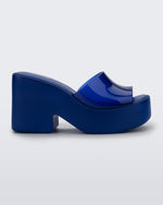 Side view of a transparent blue Posh platform mule