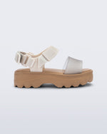 Side view of a beige/glitter kids Kick Off Sandal