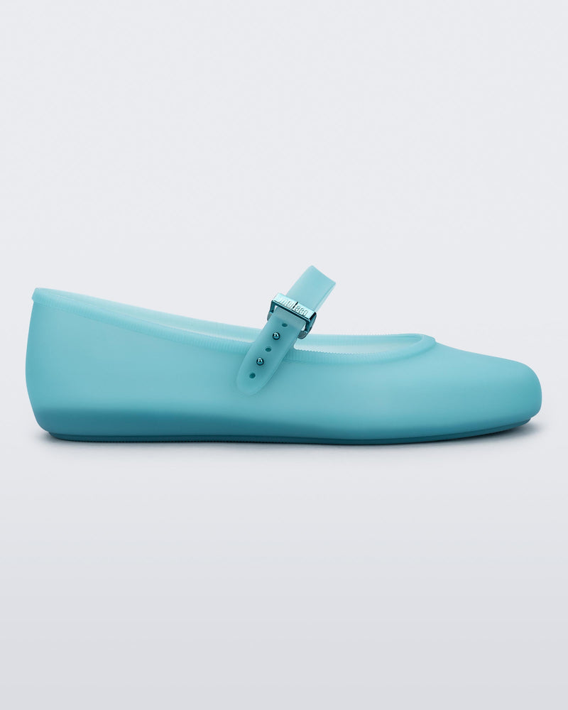 Side view of a milky blue Soft Ballerina flat
