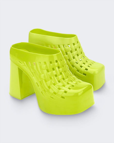 Side view of a pair of green Marshall Columbia Clog platform Boots with shaft removed.