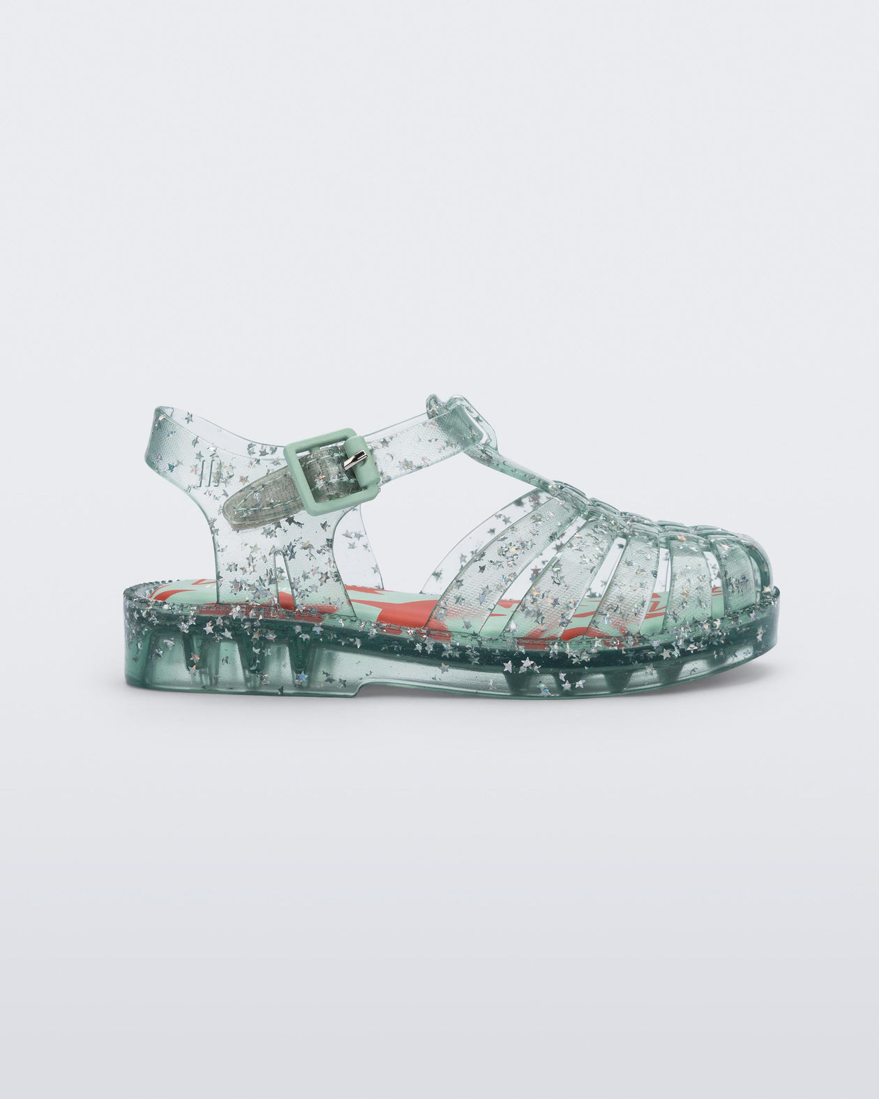 Side view of a clear star glitter green Possession baby fisherman sandal