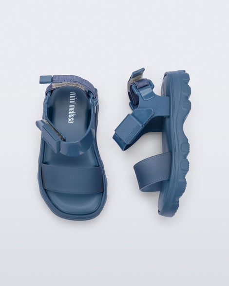 Side and top view of a pair of blue baby Kick Off Sandals.