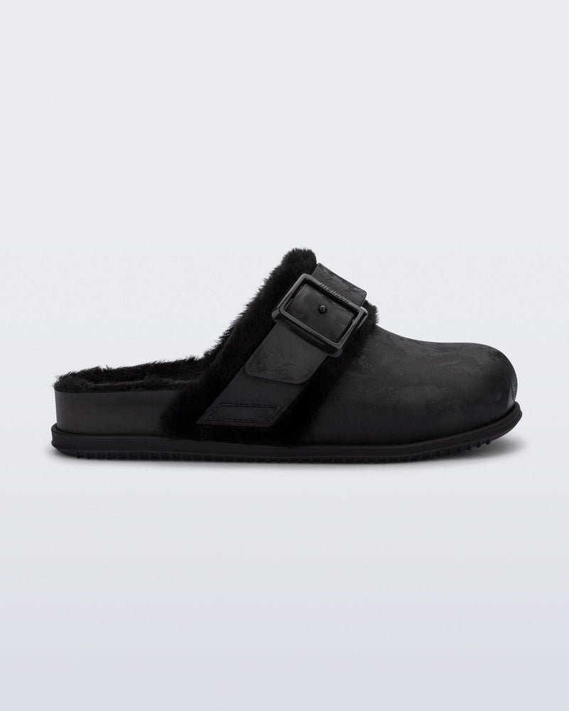 Side view of a black Cozy Warm clog with fuzzy insole