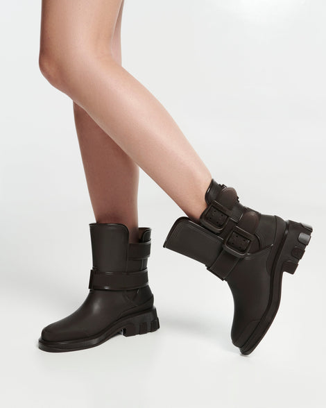 Model's legs in a pair of brown Bang boots with side buckles