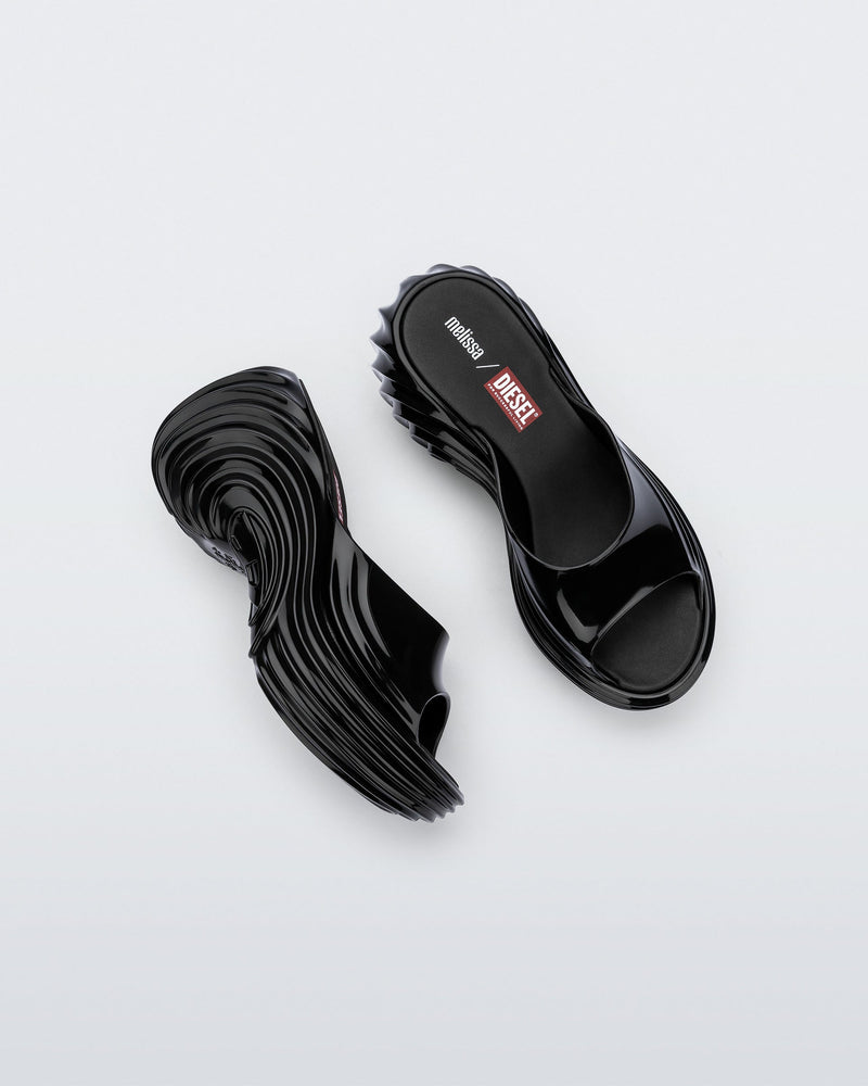 Top and side view of a pair of black Platforms + Diesel slides