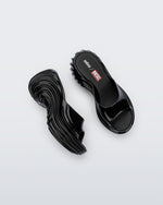 Top and side view of a pair of black Platforms + Diesel slides