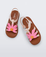Top view of a pair of pink Hip Bloom kids sandals with pink flower
