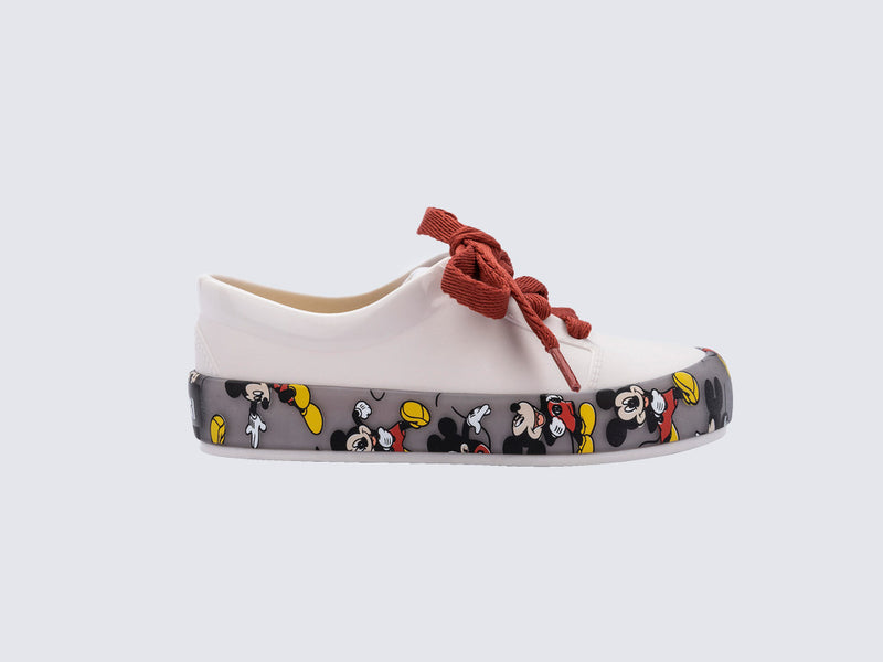 Side view of a white Street Mickey & Friends baby sneaker with red shoe laces